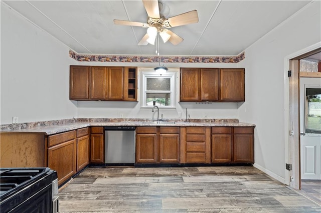 921 E Vine St, Rich Hill, MO 64779 - kitchen featuring stainless steel dishwasher, a ceiling fan, light wood-type flooring, brown cabinets, and gas stove