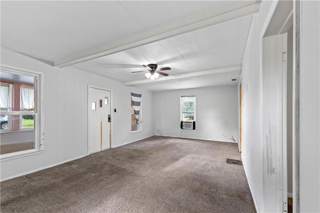 921 E Vine St, Rich Hill, MO 64779 - carpeted empty room with beamed ceiling, ceiling fan, and cooling unit