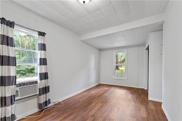 921 E Vine St, Rich Hill, MO 64779 - unfurnished room featuring wood finished floors, crown molding, and cooling unit