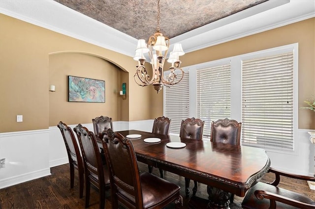 14409 Grandview St, Overland Park, KS 66221 - dining room with a chandelier, a raised ceiling, dark wood-style floors, and a wainscoted wall