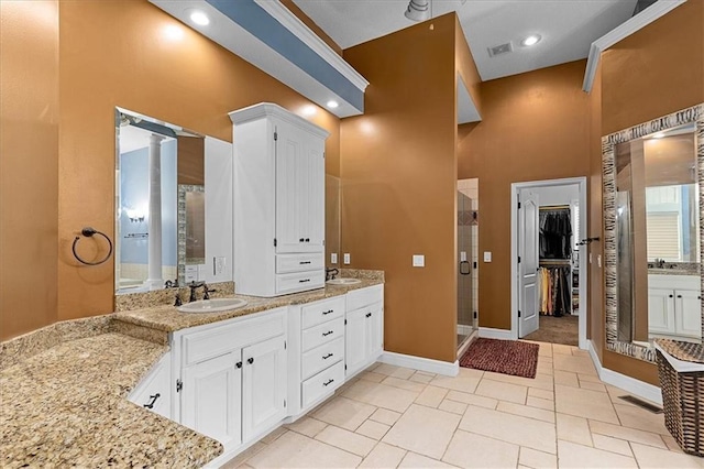 14409 Grandview St, Overland Park, KS 66221 - full bathroom with a stall shower, double vanity, and a walk in closet