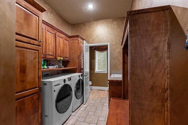14409 Grandview St, Overland Park, KS 66221 - laundry room featuring separate washer and dryer, stone finish floors, a textured ceiling, and recessed lighting