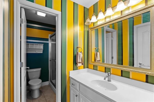 14409 Grandview St, Overland Park, KS 66221 - bathroom with vanity, a stall shower, wallpapered walls, and tile patterned flooring