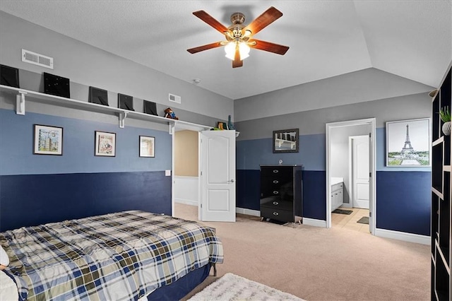14409 Grandview St, Overland Park, KS 66221 - bedroom with light colored carpet, ceiling fan, and ensuite bathroom