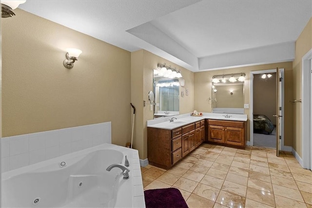 14409 Grandview St, Overland Park, KS 66221 - ensuite bathroom with double vanity, a whirlpool tub, and a textured wall