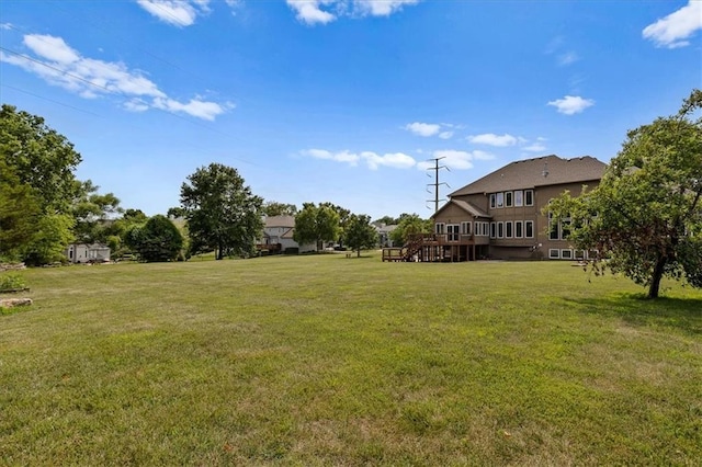 14409 Grandview St, Overland Park, KS 66221 - view of green lawn with a wooden deck