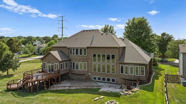 14409 Grandview St, Overland Park, KS 66221 - rear view of house with a patio area, a wooden deck, and roof with shingles