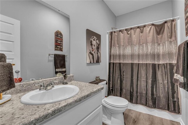 20367 W 193rd Ter, Spring Hill, KS 66083 - bathroom with vanity, wood finished floors, and shower / tub combo with curtain