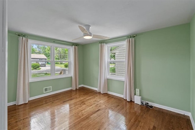 8815 W 81st St, Overland Park, KS 66204 - spare room featuring wood finished floors and ceiling fan