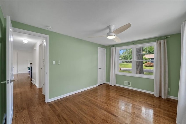 8815 W 81st St, Overland Park, KS 66204 - empty room with wood finished floors and ceiling fan