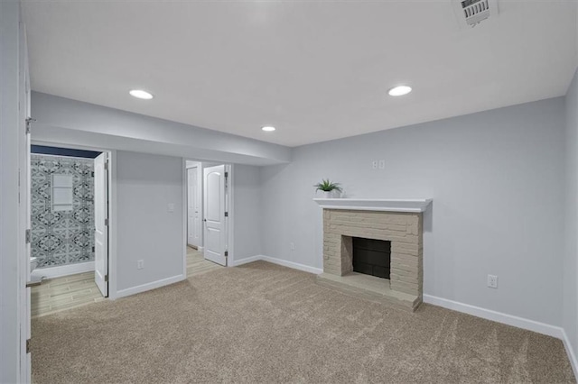 8815 W 81st St, Overland Park, KS 66204 - unfurnished living room featuring carpet, recessed lighting, and a fireplace with raised hearth