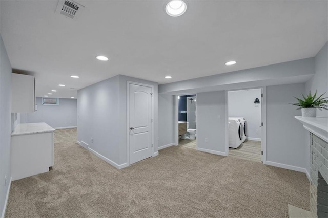 8815 W 81st St, Overland Park, KS 66204 - finished below grade area featuring independent washer and dryer, light carpet, a fireplace, and recessed lighting