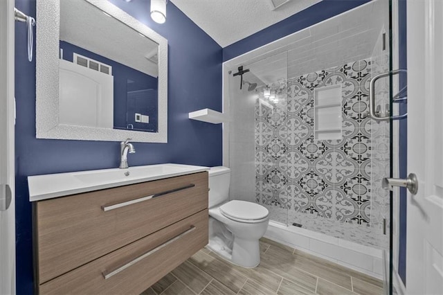 8815 W 81st St, Overland Park, KS 66204 - full bathroom featuring vanity, a tile shower, and a textured ceiling