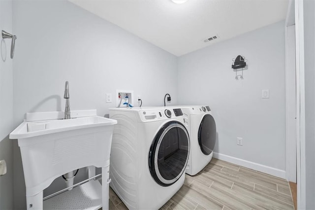 8815 W 81st St, Overland Park, KS 66204 - laundry room featuring separate washer and dryer and light wood-style floors