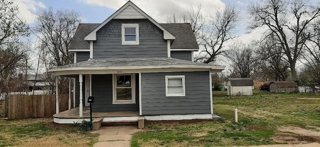 615 Church St, Neodesha, KS 66757 - view of front of home featuring a porch and a shingled roof