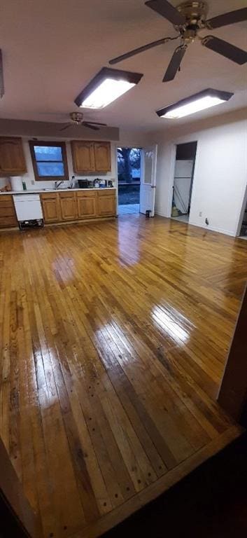 615 Church St, Neodesha, KS 66757 - unfurnished living room with ceiling fan and light wood-style flooring