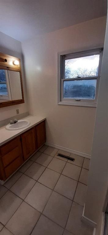 615 Church St, Neodesha, KS 66757 - bathroom with tile patterned flooring and vanity