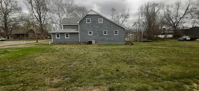615 Church St, Neodesha, KS 66757 - view of home's exterior with a trampoline and a lawn