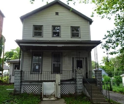 426 Pottawatomie St, Leavenworth, KS 66048 - view of front facade with covered porch and stairway