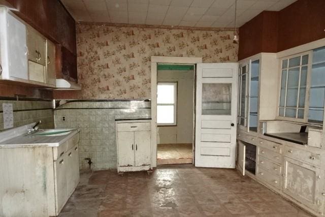 426 Pottawatomie St, Leavenworth, KS 66048 - kitchen featuring wallpapered walls and wainscoting