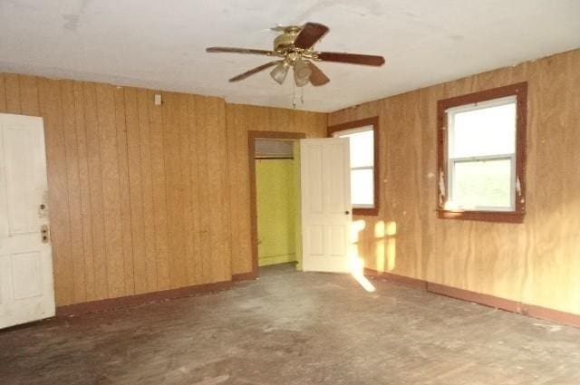 426 Pottawatomie St, Leavenworth, KS 66048 - empty room with ceiling fan and wooden walls