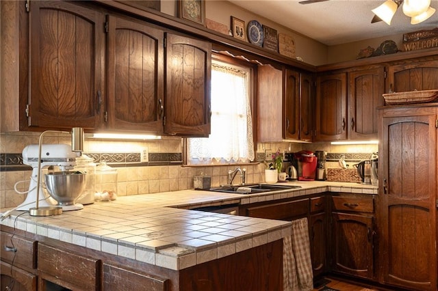 25421 Marel Rd, Excelsior Springs, MO 64024 - kitchen with tile counters, ceiling fan, and backsplash