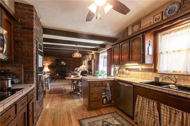 25421 Marel Rd, Excelsior Springs, MO 64024 - kitchen with tile counters, dishwasher, a peninsula, light wood-type flooring, and ceiling fan