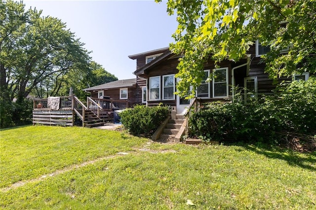 25421 Marel Rd, Excelsior Springs, MO 64024 - rear view of house featuring stairs, a lawn, and a wooden deck