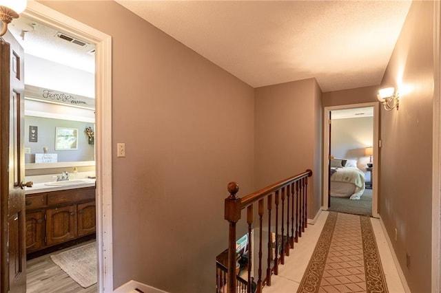 25421 Marel Rd, Excelsior Springs, MO 64024 - corridor with an upstairs landing and light tile patterned flooring