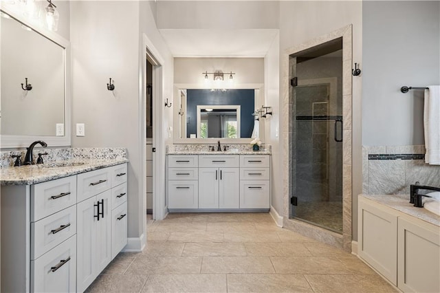 16420 Lucille St, Overland Park, KS 66221 - full bath featuring a stall shower, two vanities, and tile patterned floors