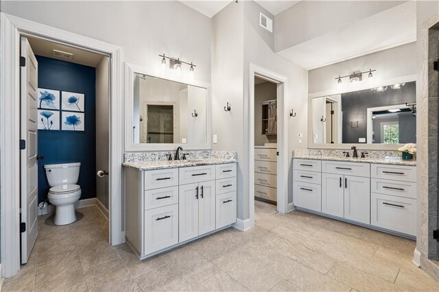 16420 Lucille St, Overland Park, KS 66221 - full bathroom featuring two vanities and tile patterned flooring