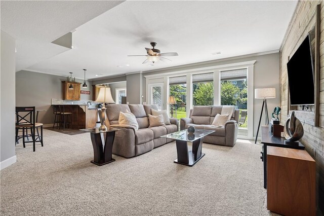 16420 Lucille St, Overland Park, KS 66221 - living area with light colored carpet, ornamental molding, and ceiling fan