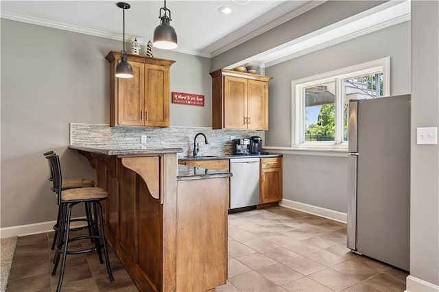 16420 Lucille St, Overland Park, KS 66221 - kitchen featuring appliances with stainless steel finishes, a peninsula, crown molding, a kitchen breakfast bar, and backsplash
