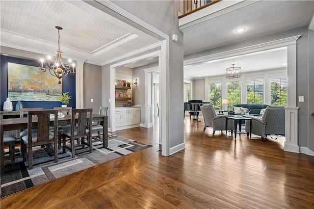 16420 Lucille St, Overland Park, KS 66221 - dining space with a chandelier, wood finished floors, and ornamental molding
