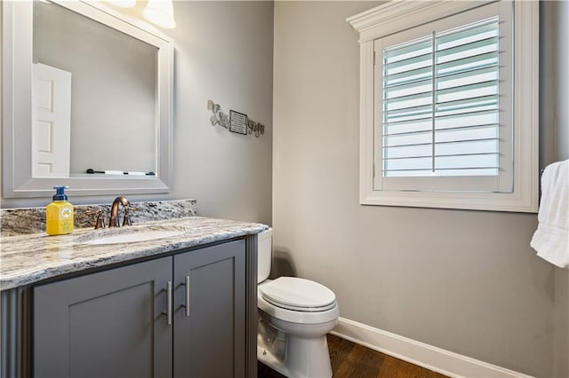 16420 Lucille St, Overland Park, KS 66221 - half bath featuring wood finished floors and vanity