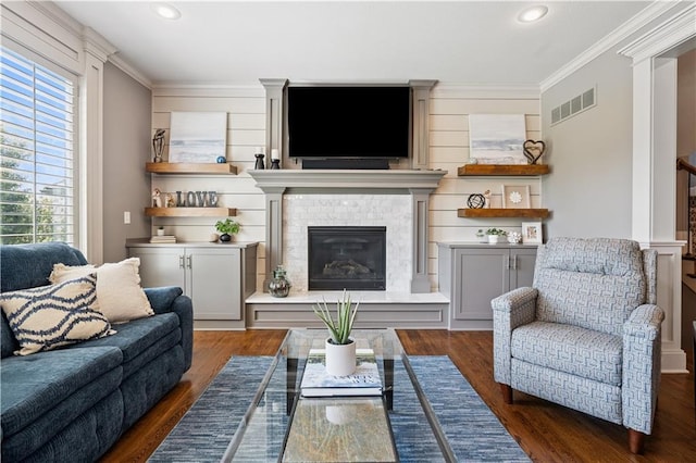 16420 Lucille St, Overland Park, KS 66221 - living area with crown molding, a glass covered fireplace, recessed lighting, and wood finished floors