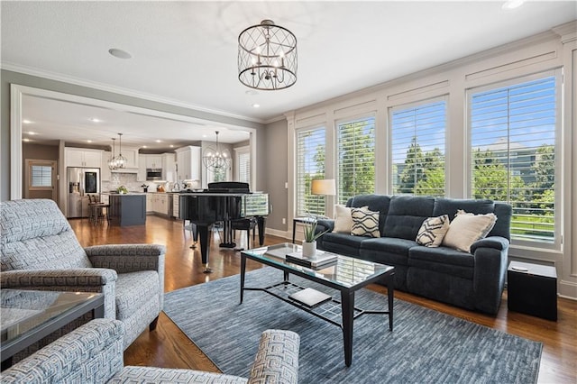 16420 Lucille St, Overland Park, KS 66221 - living area with a chandelier, crown molding, recessed lighting, and dark wood-style floors