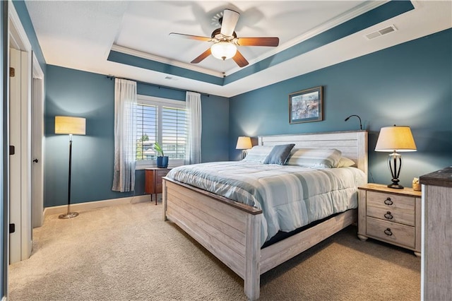 16420 Lucille St, Overland Park, KS 66221 - carpeted bedroom featuring a tray ceiling, ornamental molding, and a ceiling fan