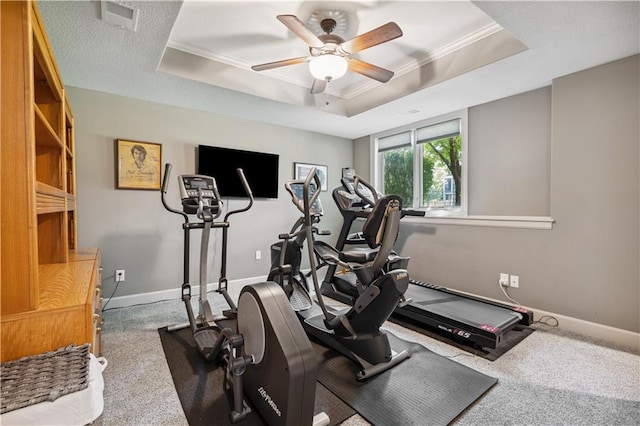 16420 Lucille St, Overland Park, KS 66221 - workout area featuring a tray ceiling, carpet floors, a ceiling fan, and ornamental molding