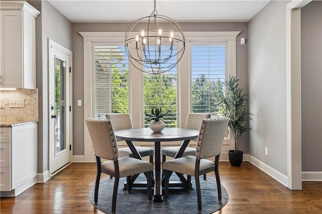 16420 Lucille St, Overland Park, KS 66221 - dining room with dark wood-type flooring and a chandelier