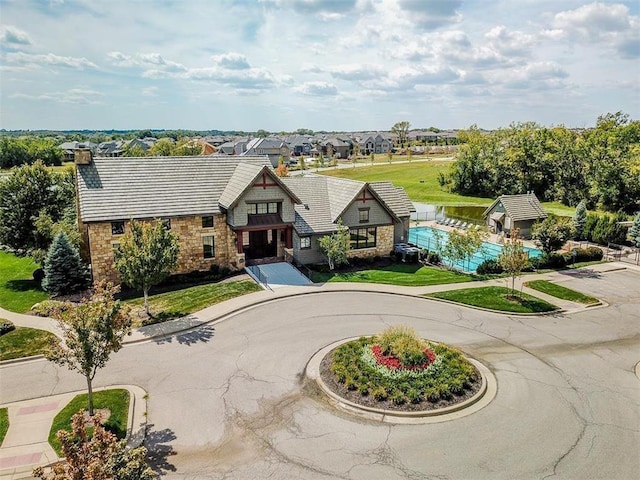 16420 Lucille St, Overland Park, KS 66221 - view of front of house with stone siding and a chimney