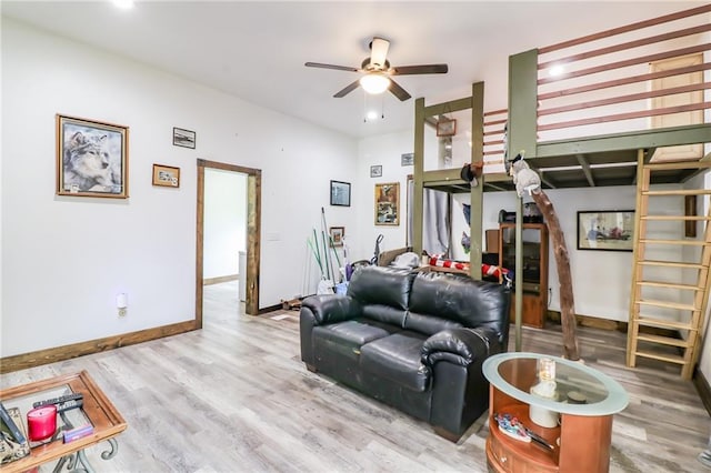 600 W Chestnut St, Holden, MO 64040 - living room featuring a ceiling fan, wood finished floors, and recessed lighting