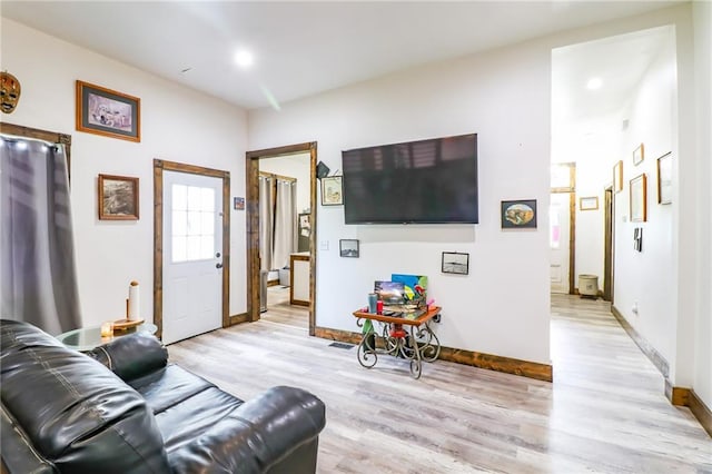 600 W Chestnut St, Holden, MO 64040 - living room featuring light wood-style flooring and baseboards