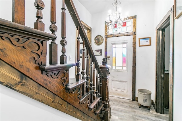 600 W Chestnut St, Holden, MO 64040 - foyer featuring wood finished floors, a chandelier, and stairway