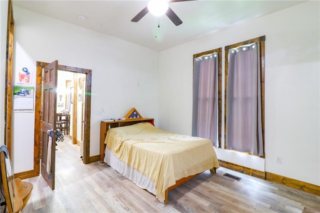 600 W Chestnut St, Holden, MO 64040 - bedroom with light wood-style flooring and a ceiling fan