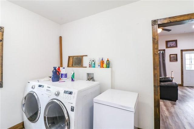 600 W Chestnut St, Holden, MO 64040 - laundry area with independent washer and dryer, wood finished floors, and ceiling fan