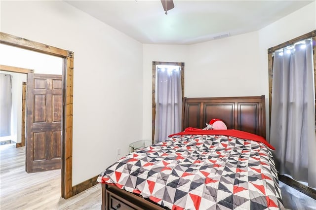 600 W Chestnut St, Holden, MO 64040 - bedroom with light wood finished floors and a ceiling fan