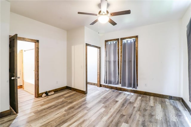 600 W Chestnut St, Holden, MO 64040 - empty room featuring ceiling fan and wood finished floors