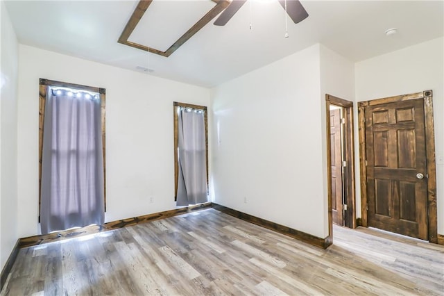 600 W Chestnut St, Holden, MO 64040 - spare room featuring ceiling fan, attic access, light wood-style floors, and a smoke detector