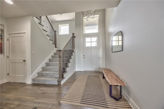 24976 W 87th St, Lenexa, KS 66227 - entrance foyer featuring stairs, wood finished floors, and a high ceiling